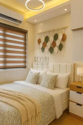 a bedroom with a bed and a window at Seyuri Staycation Haven in Manila