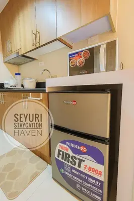 a kitchen with a box of first responder oven at Seyuri Staycation Haven in Manila