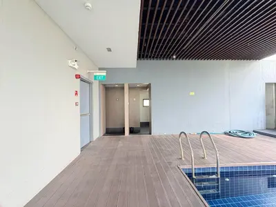 an empty hallway of a building with a swimming pool at The Cube in Cubao in Quezon City