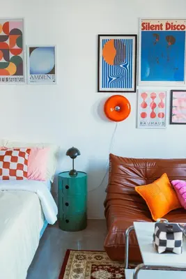 a living room with a bed and a couch at The Cube in Cubao in Quezon City