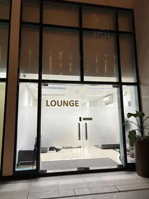 a store window with the words lounge on it at ONE UPTOWN RESIDENCE BGC 2-bed 1BR in Manila