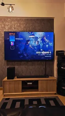 a large flat screen tv on a wall at SW Staycation Liam Suite SMDC Hope Residences Beside SM City in Trece Martires