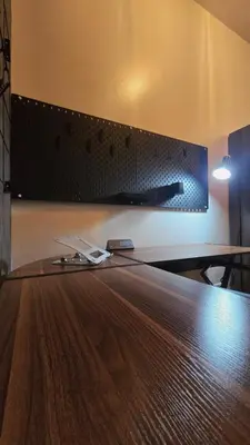 a wooden table in a room with a wall at SW Staycation Liam Suite SMDC Hope Residences Beside SM City in Trece Martires