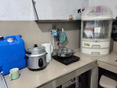 a kitchen counter with a coffee maker and a blender at Harong ni Lynda in Ibaba