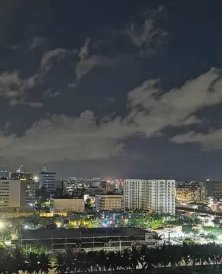 a city skyline at night with buildings and lights at Mall of Asia shore 3 tower 2 residence in Manila