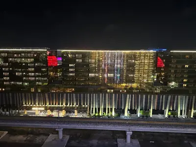 a night view of a city with tall buildings at Spacious 12-Pax Stay Near Airport, City of Dreams, Okada, Ayala Malls, MOA & Solaire in Manila