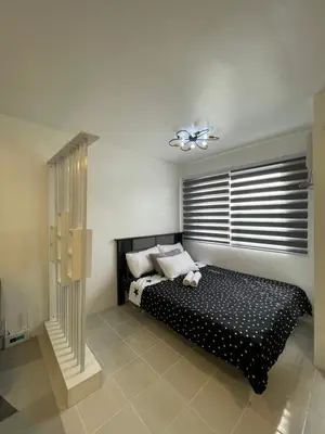 a bedroom with a black bed and a window at Stylish Minimalist Comfort Stay Beside EK in Santa Rosa