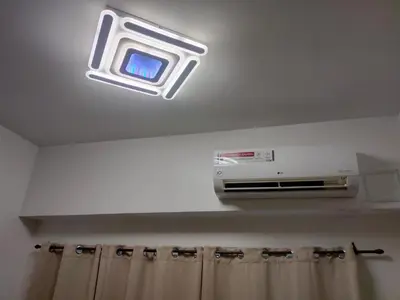 a light on the ceiling of a bathroom at Shore Residence Tower C2 in Manila