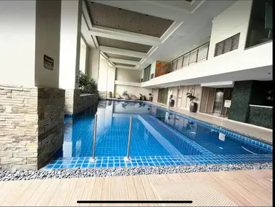 a large swimming pool in a building at KL Studio close to Greenbelt in Manila