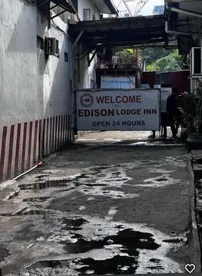 a sign for a welcome to the electron tobacco inn at Edison Lodge hotel in Manila