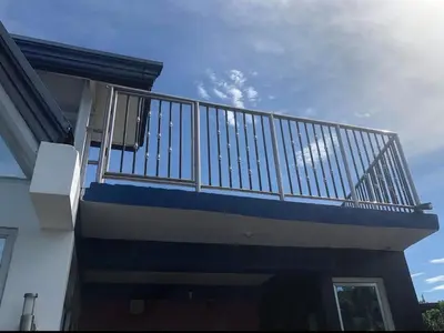a balcony on the side of a house at Noirescape in Binangonan