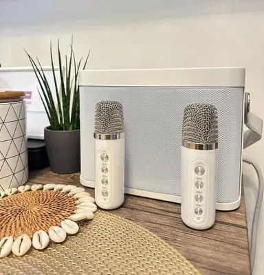 two microphones sitting on a table next to a radio at Luxury staycation at prime location Mall of Asia Shell Residences Pasay Tower C in Manila