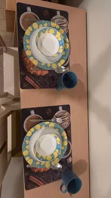 a wall with two plates of food on it at DH Suites in Manila