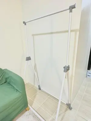 a room with two tripod stands in front of a white wall at Comfy Spot Staycation Studio at Kasara Urban Pasig in Manila