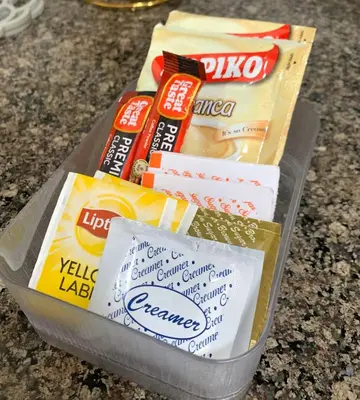 a container of food sitting on top of a counter at Hometel by ECR at Viceroy Residences in Manila