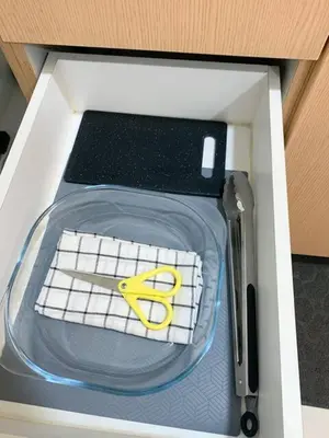 a box with a keyboard and a pair of scissors at Hometel by ECR at Viceroy Residences in Manila