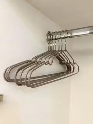a metal towel rack hanging on a wall at Hometel by ECR at Viceroy Residences in Manila
