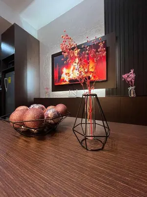 two vases on a table in a living room at Escape Haven in Manila