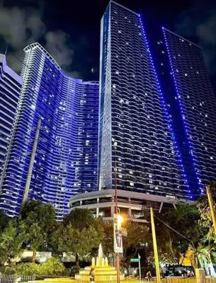 a large building with blue lights on it at Escape Haven in Manila