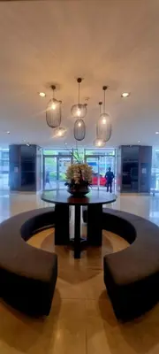 a large room with a table and some lights at All I Want Relax at Shore Residences in MOA Complex in Manila