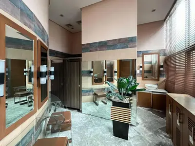 a bathroom with a sink and a large mirror at Scandi 1 BR Home Golf View BGC in Manila