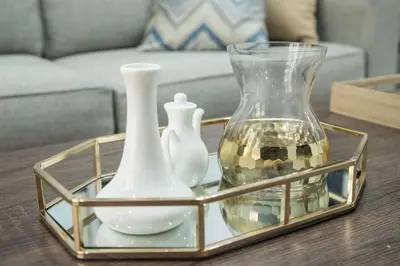 a tray with two vases and a glass container on a table at Julias Contemporary Apt Balcony and Golf View in Manila