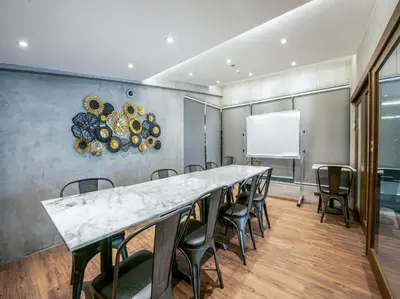 a conference room with a long table and chairs at Solace Hotel in Manila