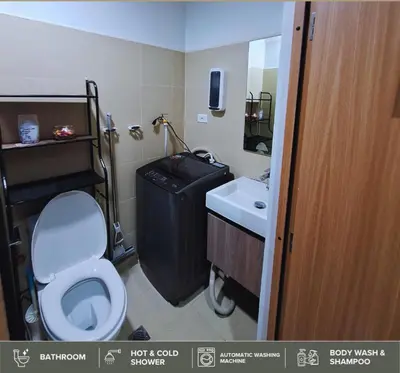 a bathroom with a toilet and a sink at Shore Residences - Near Mall of Asia in Manila