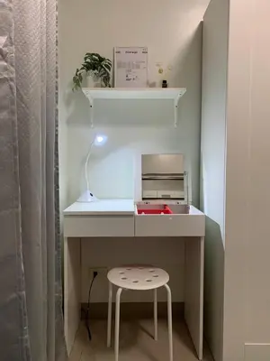 a white desk with a printer and a stool at Olivia in Manila