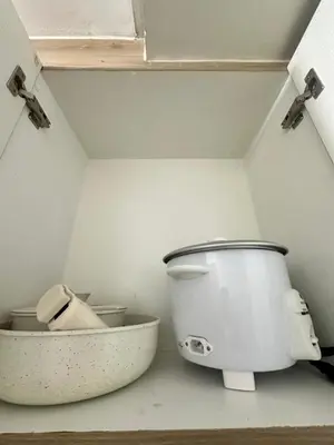 a bathroom with a toilet in a small room at The Hideout Condotel in Shore 2 Residences Tower 3 in Manila