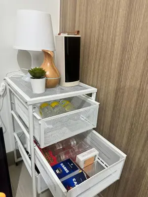 a white shelf with food and a lamp in a room at The Hideout Condotel in Shore 2 Residences Tower 3 in Manila