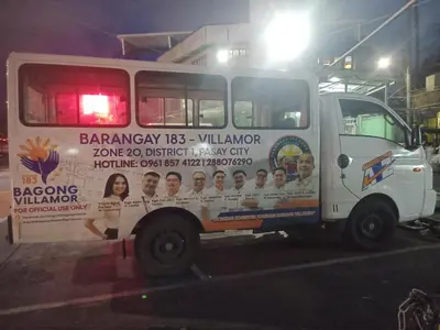a white truck parked in a parking lot at night at 150 Newport Boulevard in Manila