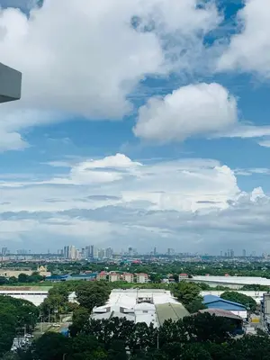 a view of a city under a cloudy sky at The Hive Condo Staycation Condo at Taytay Rizal in Taytay