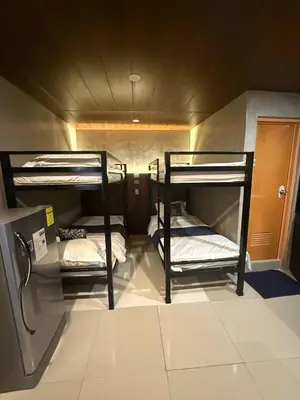 a room with two bunk beds in it at HM Eco Hotel NAIA in Manila