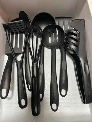 a group of utensils sitting on top of a drawer at South Breeze Stay Near Nuvali, Enchanted kingdom, Tagaytay in Silang