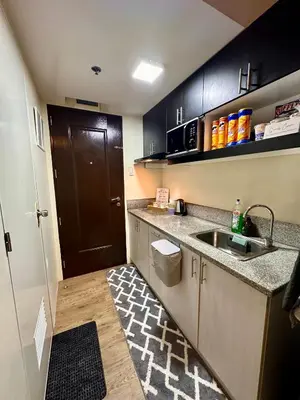 a small kitchen with a sink and a counter at South Breeze Stay Near Nuvali, Enchanted kingdom, Tagaytay in Silang