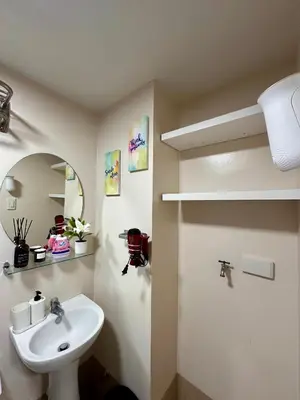 a bathroom with a sink and a mirror at South Breeze Stay Near Nuvali, Enchanted kingdom, Tagaytay in Silang
