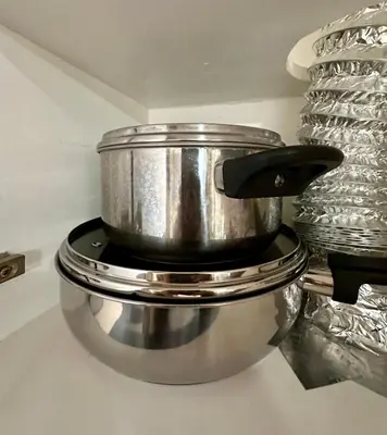 a large silver pot sitting on top of a counter at South Breeze Stay Near Nuvali, Enchanted kingdom, Tagaytay in Silang