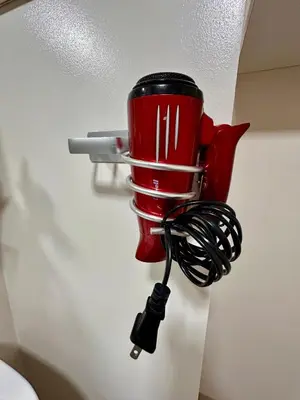 a red coffee pot hanging from a wall at South Breeze Stay Near Nuvali, Enchanted kingdom, Tagaytay in Silang