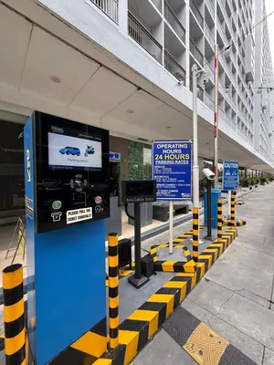 a gas station with a television in a building at Biens Staycation at SHORE Residences near Mall of Asia in Manila
