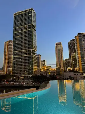 a large pool of water in a city with tall buildings at Novotel Hotel Residences at Acqua- AMOREsuite in Manila