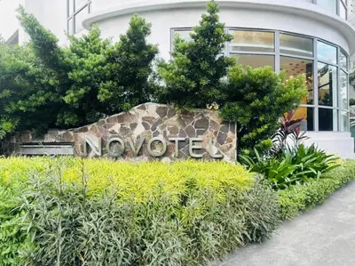 a sign for a november sign in front of a building at Novotel Hotel Residences at Acqua- AMOREsuite in Manila