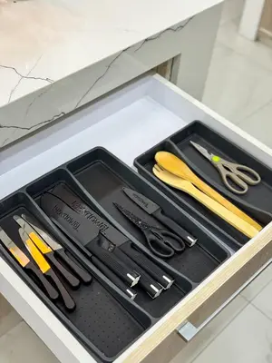 a drawer filled with cutting utensils on a counter at Halika Villa & Capitolo events place near BGC in Manila