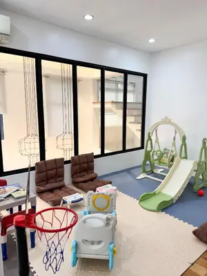 a play room with a playground with a slide at Halika Villa & Capitolo events place near BGC in Manila