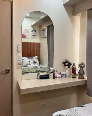 a bathroom with a sink and a mirror at Mazal Residence in Manila