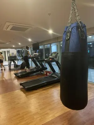 a gym with a punching bag hanging from a chain at Panoramic Seaview 2BR near Airport Facing the Bay 6G in Manila