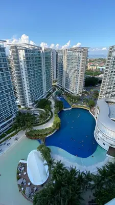 an aerial view of a resort with tall buildings at Azure Daily in Manila