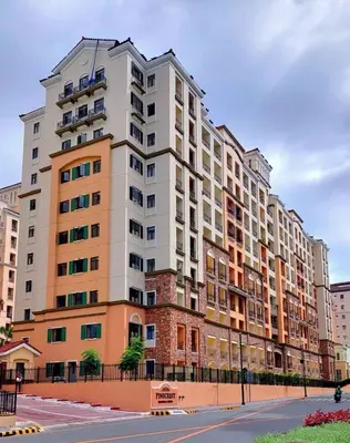 a large apartment building on the corner of a street at Newport City Home- Naia T3 in Manila