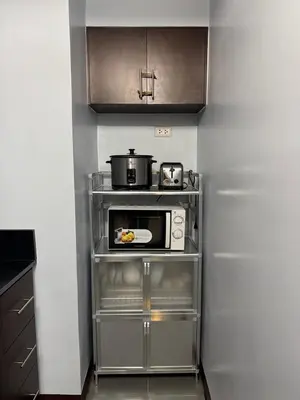 a kitchen with a microwave and a pot on top of it at Newport City Home- Naia T3 in Manila