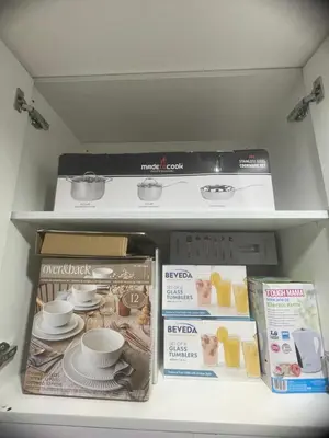 a shelf in a refrigerator filled with food at Field residences Building 9 in Manila